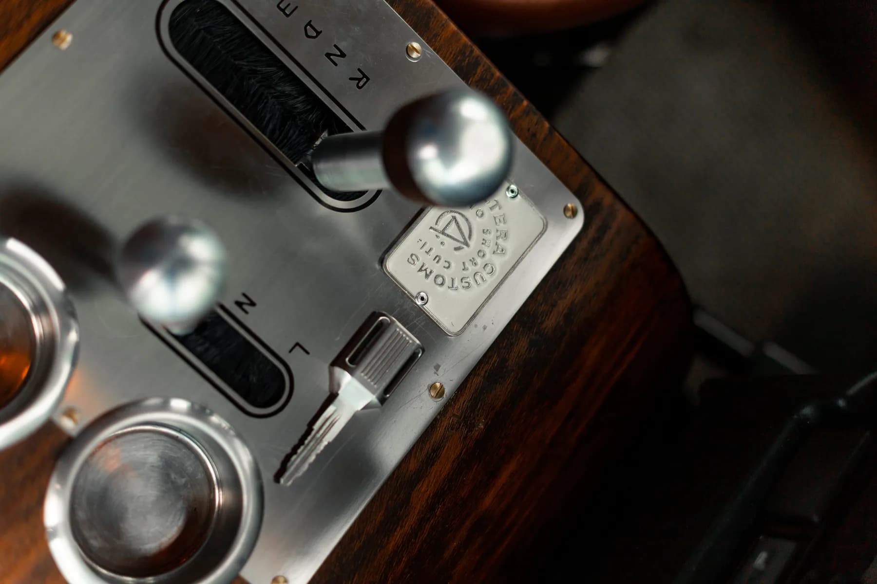 Altera wood console with machined selectors and atelier badge