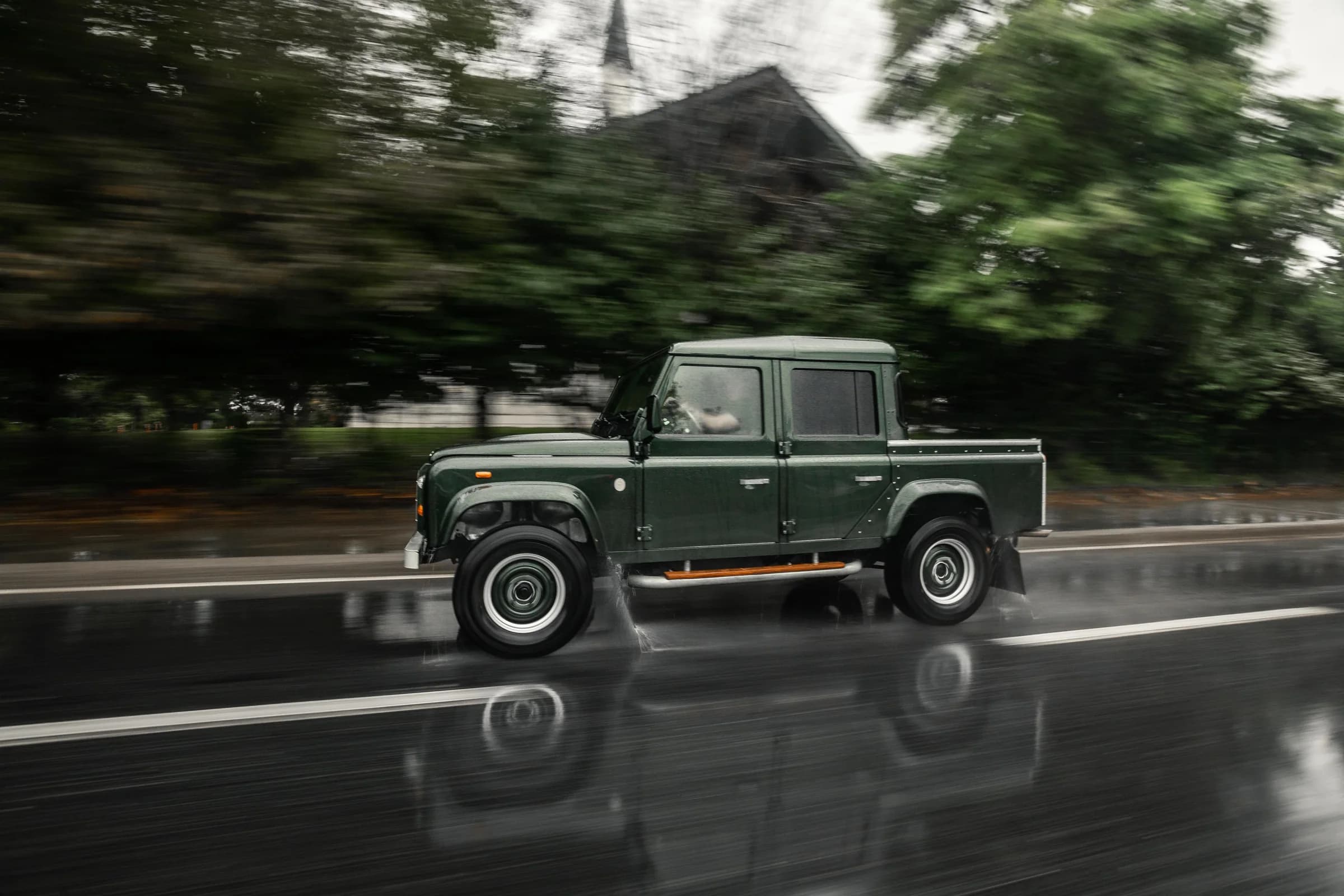 Altera Defender crew cab driving on a wet road